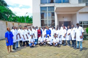 A group photo of the students in front of the Cutix Cable Plc building